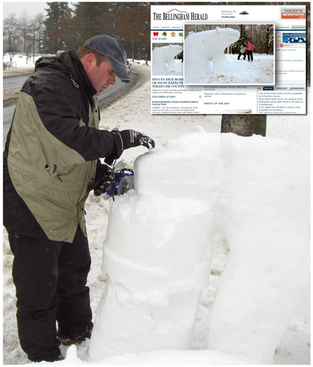 Tim Probst of "A Better Clean Windows And Gutters" carves a polar bear in the snow along Lakeway Drive in Bellingham WA